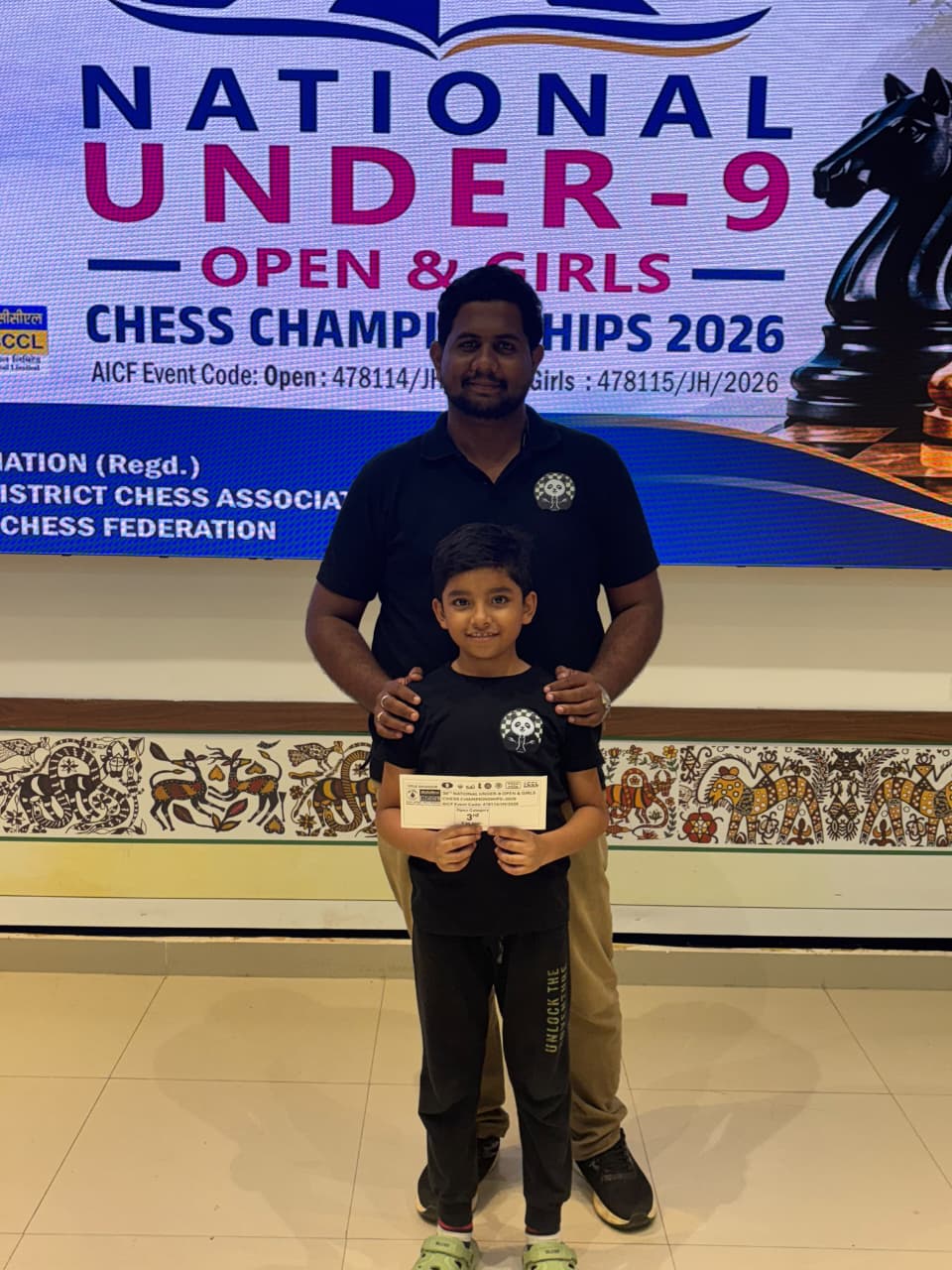 Siddharth Anuj, Chess Panda student, holding a tournament award