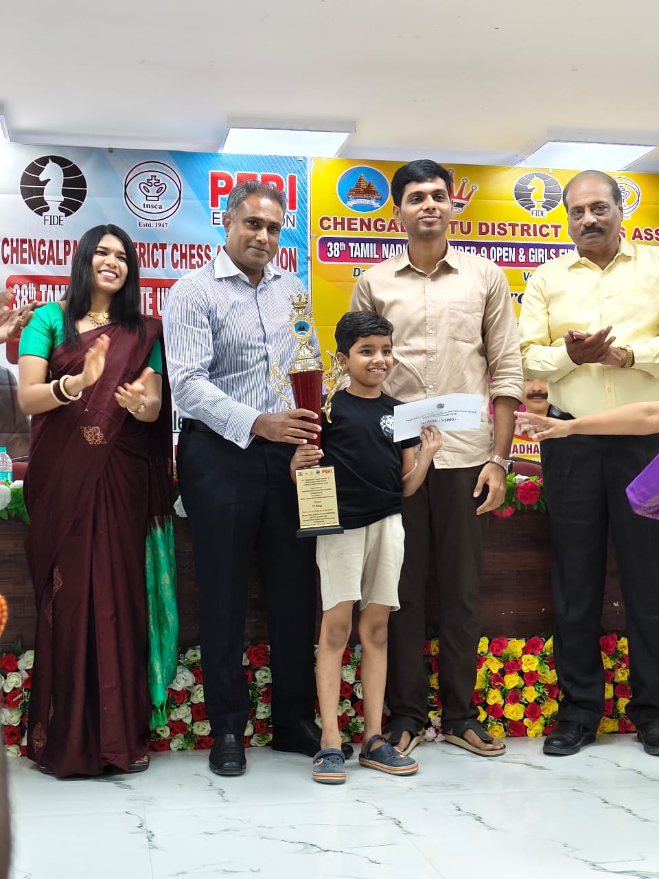 Siddharth Anuj, Chess Panda student, holding a tournament award